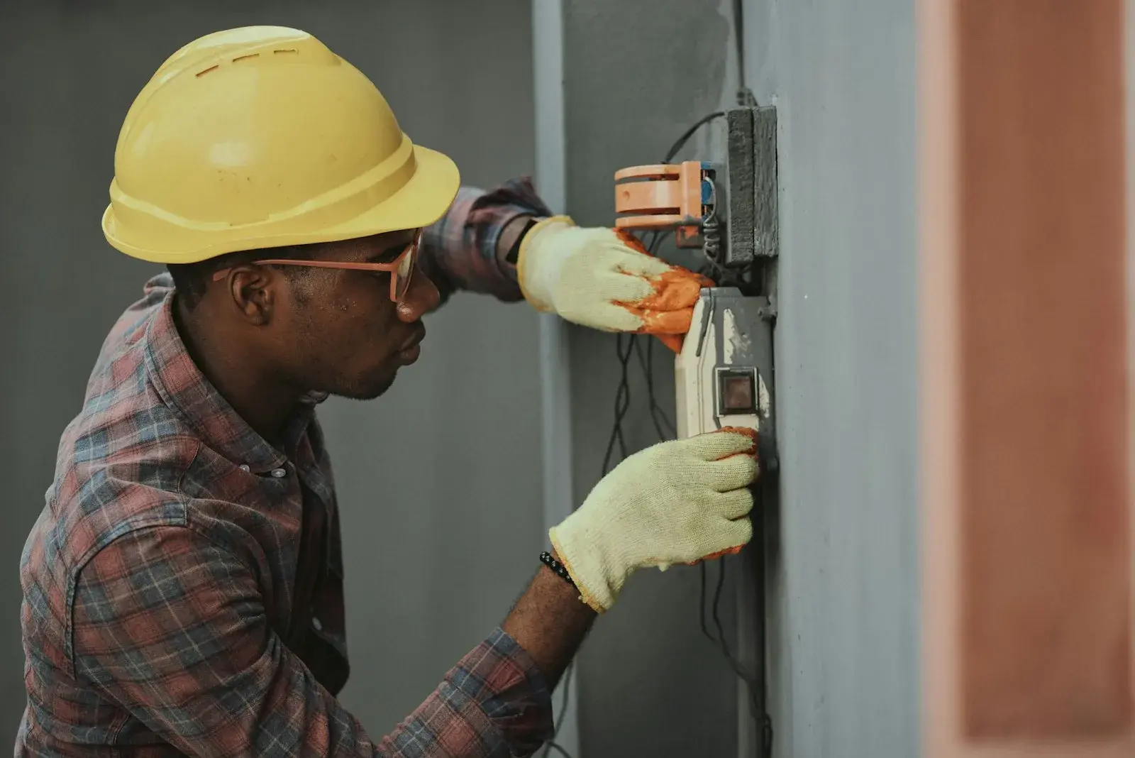 Electrical panel inspection and wiring work by an electrician in Kathmandu